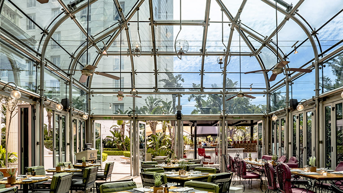 A greenhouse-style restaurant at the Four Seasons Hotel Buenos Aires with lots of beautiful natural lighting.