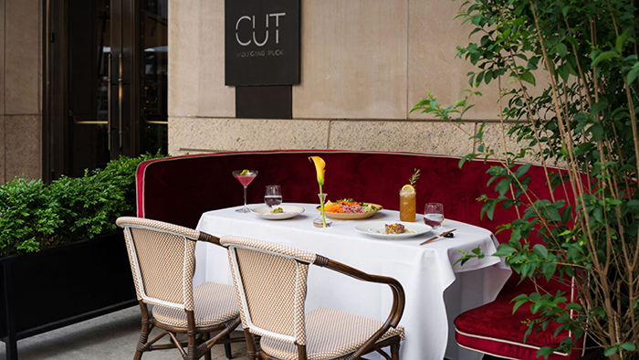 Outdoor seating at the CUT restaurant located at the Four Seasons Hotel New York Downtown, by celebrity chef Wolfgang Puck.
