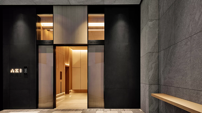 The elegant, minimalist entrance to the AKI Hong Kong - MGallery hotel.