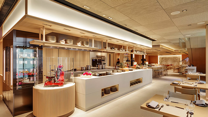 A common dining area where breakfast is served inside the AKI Hong Kong - MGallery hotel.
