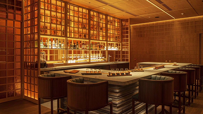A swanky bar inside the AKI Hong Kong - MGallery hotel where flights of whiskey are being served.