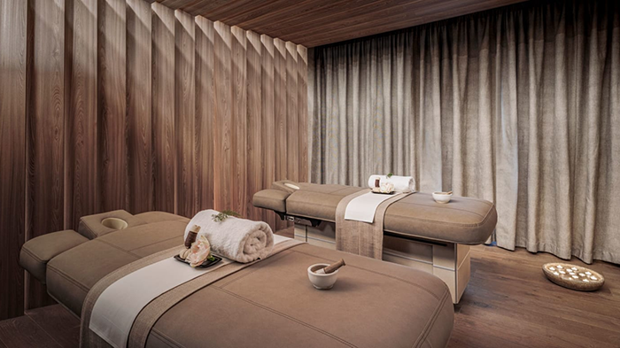 A massage room inside the Anantara Palazzo Naiadi Rome Hotel. Two massage tables are sitting parallel.