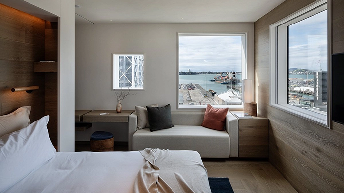 A guest room at The Hotel Britomart. Auckland Harbour is visible through the window.
