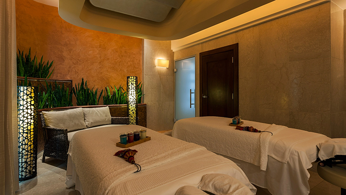 A massage room at the Condado Vanderbilt Hotel. It looks like it's been set up for a couples massage.