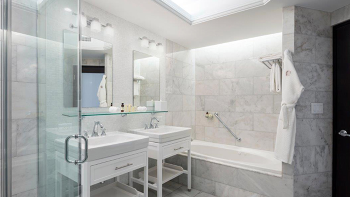 A guest bathroom in San Juan's Condado Vanderbilt Hotel. The walls are entirely marble.