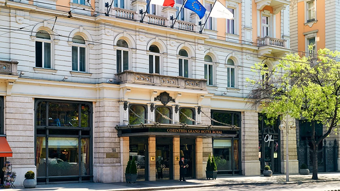 An exterior shot of the Corinthia Budapest Hotel. An awning with the text 
