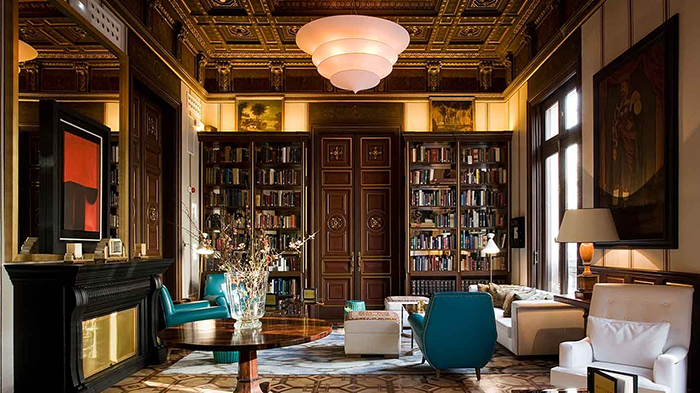 The library at the Autograph Collection Cotton House Hotel. A variety of books are available for guests' enjoyment.