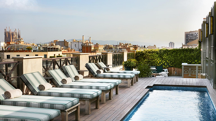 The small rooftop pool at the Autograph Collection Cotton House Hotel. La Sagrada Familia is visible in the background.