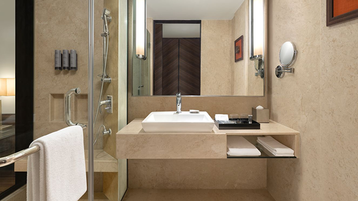 A guest bathroom at the Courtyard by Marriott Mumbai International Airport Hotel. The camera isn't visible despite facing the mirror directly, which suggests some image manipulation.