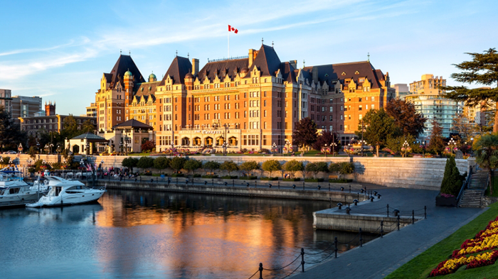 An exterior image of the Fairmont Empress in Victoria, British Columbia. Victoria Harbour is visible in the foreground.