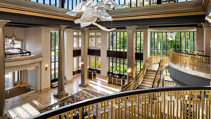 The main lobby of the Fairmont Empress hotel. An abundance of windows allow plenty of natural light into the space.