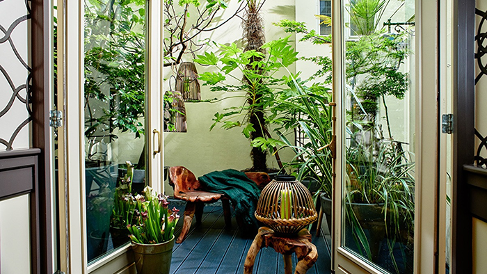 The Hotel Estherea's courtyard, where an abundance of plants make for an extremely inviting space.