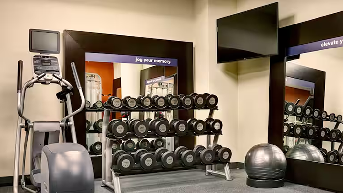 The Hampton Inn Brooklyn/Downtown hotel's fitness center. There's a large selection of free weights available.