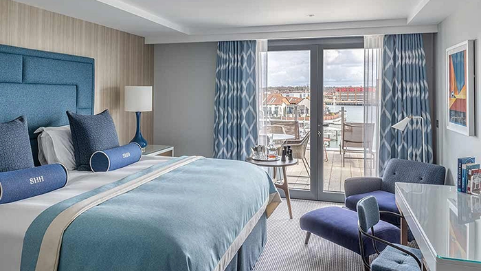 A guest room at the Harbour Hotel in Southampton. A nice view of the water is visible through the window.