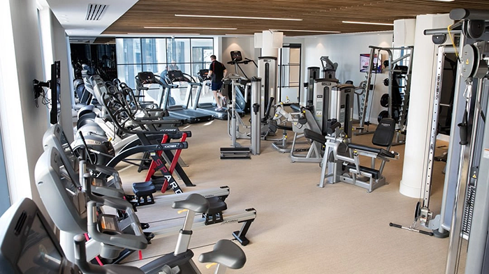 The gym inside the Harbour Hotel Southampton. A guest is shown running on a treadmill.