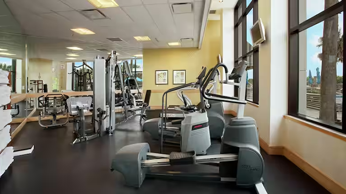 The gym inside the Hilton Cocoa Beach Oceanfront hotel. There's a window on the right side of the room that faces the pool.