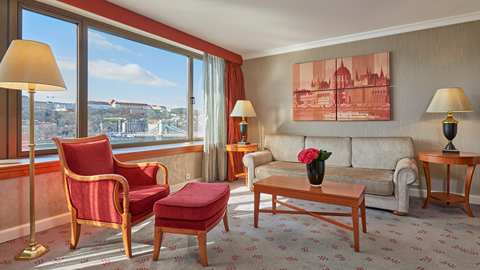 A photo of a guest suite at the InterContinental Budapest hotel. There's an artistic depiction of the Hungarian Parliament building hanging on the wall.
