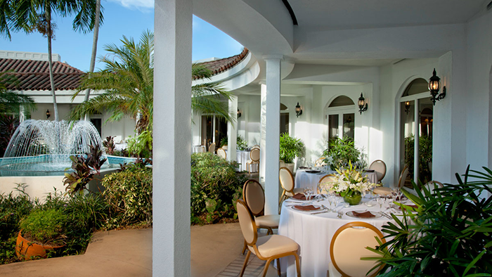 An outdoor dining area at the Lago Mar Beach Resort & Club in Fort Lauderdale, Florida.