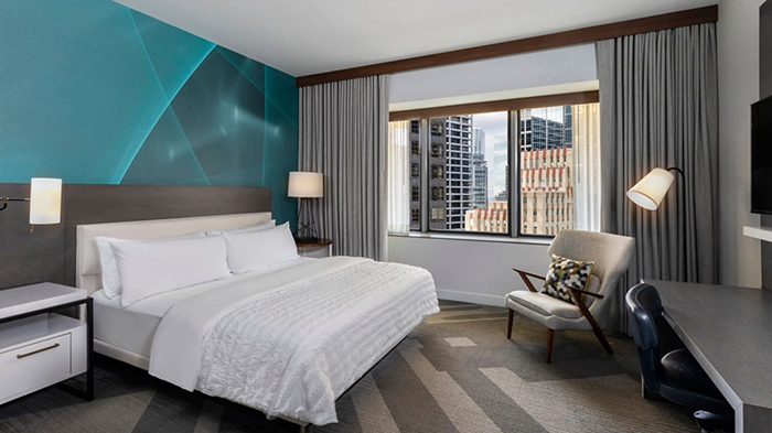 A guest room at the Le Mridien Houston Downtown. There's a lovely view of the city through the window.