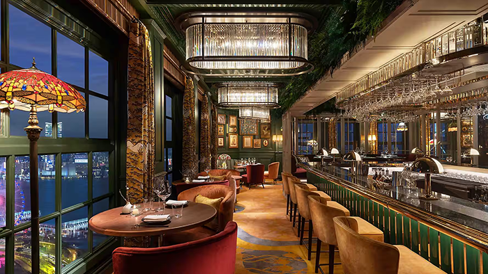 One of the bars inside the Mandarin Oriental, Hong Kong hotel. The walls are painted an incredible shade of green.