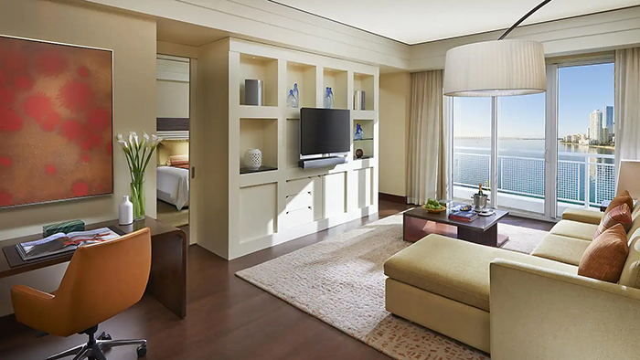 A guest suite inside the Mandarin Oriental Hotel in Miami. The room is decorated in an elegant beach-y style.