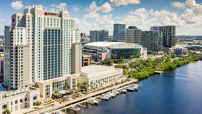An outdoor shot of the Tampa Marriott Water Street Hotel. Amalie Arena is seen to be just next door.