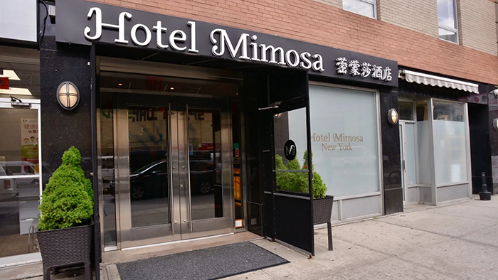 An exterior shot of the Hotel Mimosa in New York City's Chinatown.