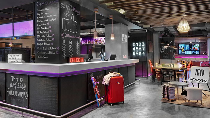 The check-in area at the Moxy Bucharest Old Town Hotel. The interior design is very funky.