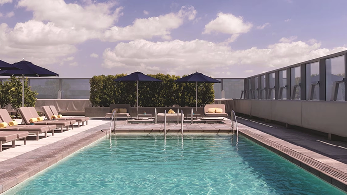 The Ritz-Carlton Los Angeles Hotel's rooftop pool. The clouds in the background look like they're straight out of a painting.
