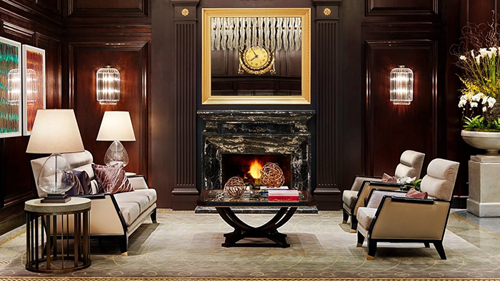 A common area inside the Rosewood Hotel Georgia. This one features a beautiful fireplace.