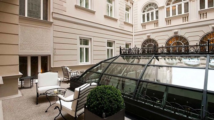 A courtyard at the Savoia Excelsior Palace hotel in Trieste. There's a glass dome-like structure through which you can look at the floor below.