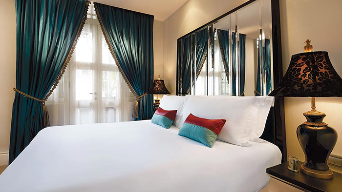 A subtly decorated guest room at the Scarlet Singapore.