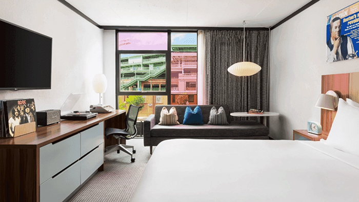 One of the guest rooms at the Verb Hotel in Boston. Fenway Park, home of the famous Red Sox baseball team, is visible through the window.