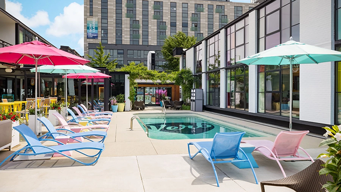 The Verb Hotel's pool area. The space's vibrant colors evoke a feeling of leisure.